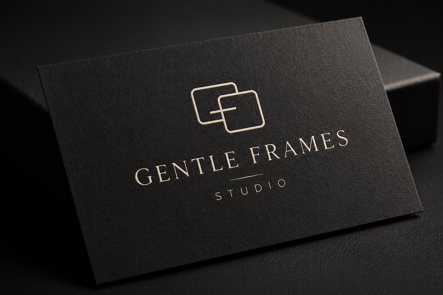 Gentle Frames business card, black paper with champagne foil